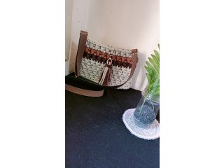 Homemade crochet bag with leather bottom and strap