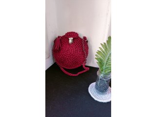 Homemade purple crochet circle bag with clasp and good tassel